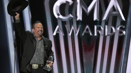 FILE - Garth Brooks accepts the entertainer of the year award at the 53rd annual CMA Awards in Nashville, Tenn. on Nov. 13, 2019. Brooks is reportedly pulling himself out of the nominations for the Country Music Association's entertainer of the year award, saying it's time for someone else to win the top prize. Brooks, who won the grand prize last November, said in an online press conference Wednesday that he is not seeking reelection in the coming years. (AP Photo/Mark J. Terrill, File)