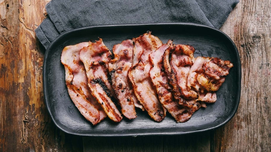Image of a comparison chart highlighting the benefits of dehydrated bacon over traditional bacon.