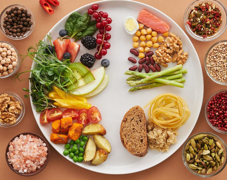 Images representing a balanced diet, including fruits, vegetables, whole grains, and lean protein.