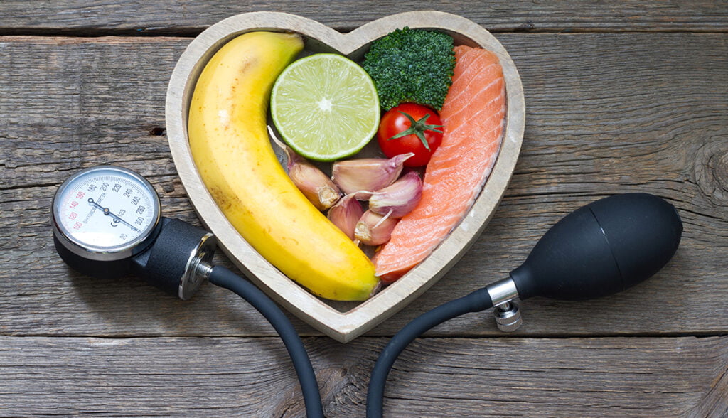 Health heart diet food concept with blood pressure gauge